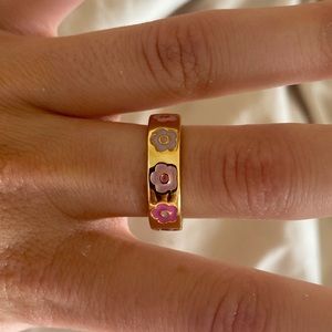 Gold ring with flower detailing, size 7.